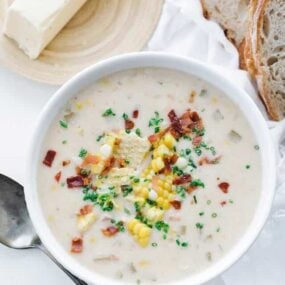 corn chowder served with sliced bread