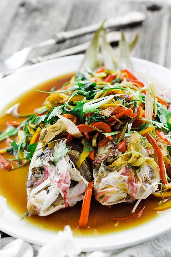 steamed fish with veggies and sauce