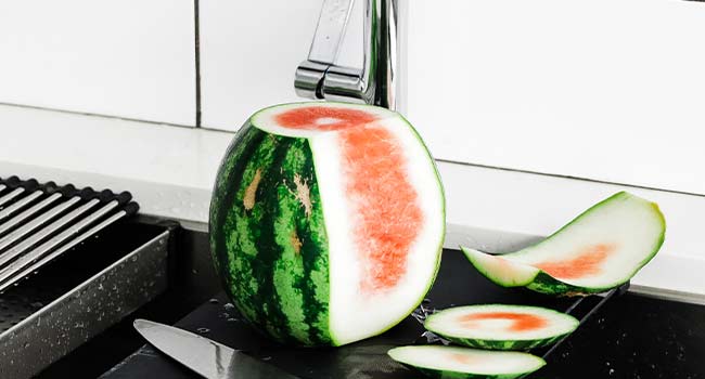 peeling a watermelon