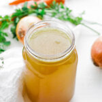 chicken stock in a jar with vegetables