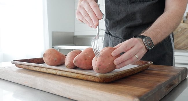 poking holes in sweet potatoes