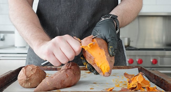 peeling sweet potatoes