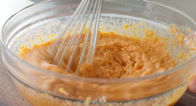 mixing sweet potato pie filling