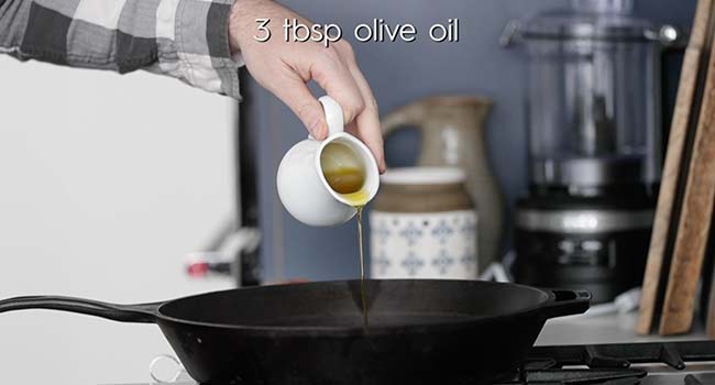 adding oil to a pan