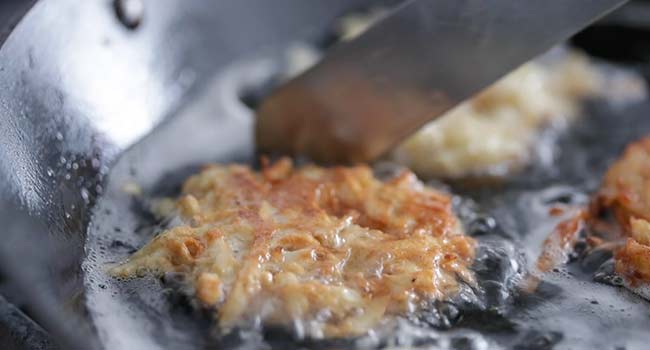 cooking a latke in oil