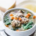 italian wedding soup with cheese in a bowl