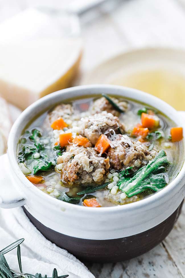 italian wedding soup with cheese in a bowl