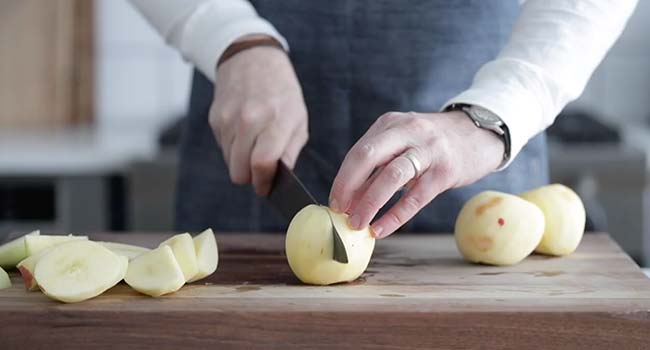 slicing chunks off of apples