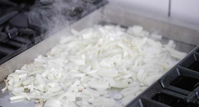 searing onions on a flat top