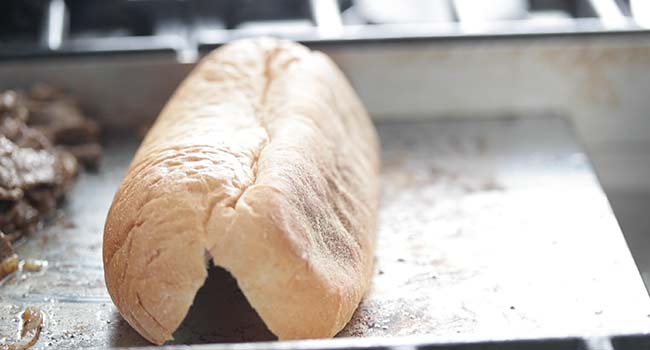 toasting a bun on a griddle