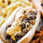 cheesesteak sandwich with fries