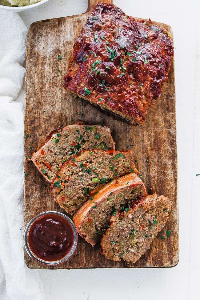 meatloaf on a cutting board with glaze