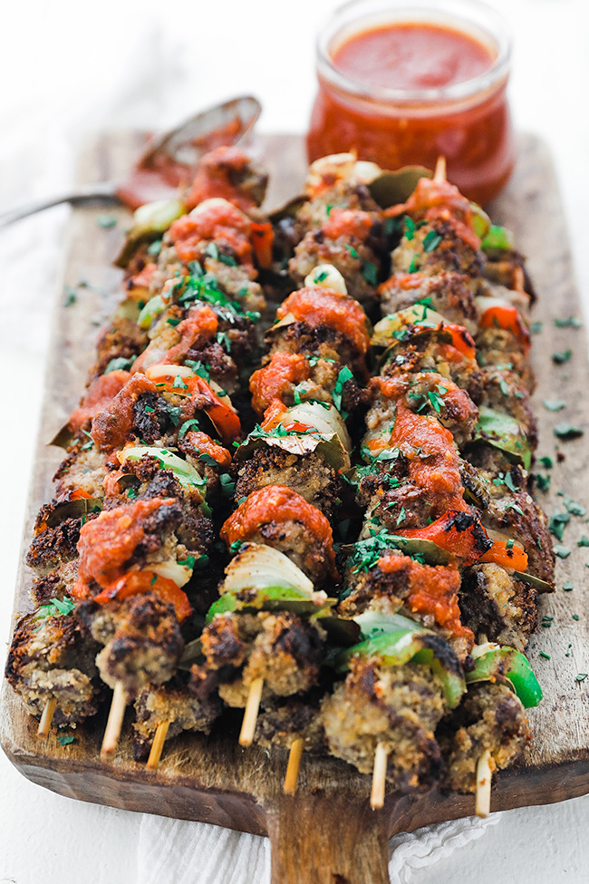 beef spiedini on a cutting board