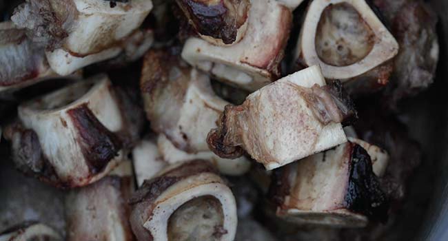 roasted beef bones in a pan