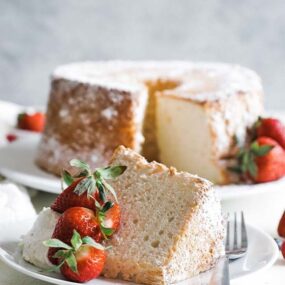 slice of angel food cake with whipped cream and berries