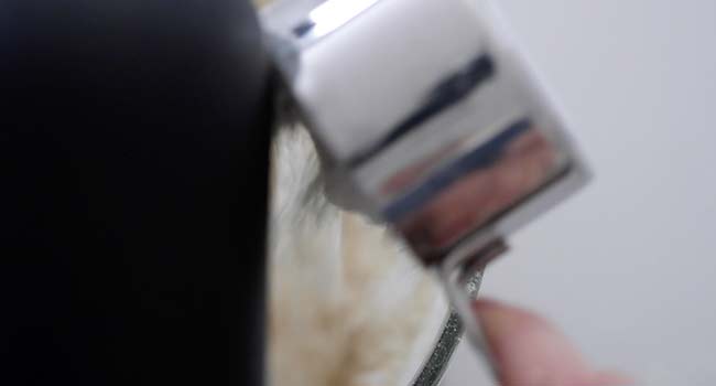 pouring dry ingredients into a bowl