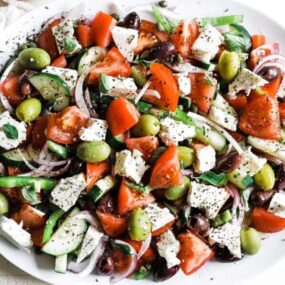 greek salad with vegetables on a platter