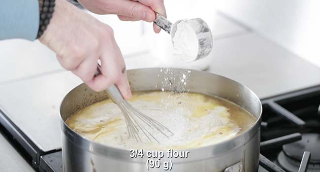 whisking flour into a soup