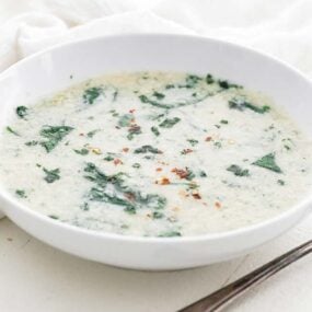 bowl of stracciatella soup with spinach