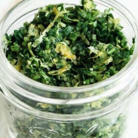 parsley and garlic in a jar with lemon zest