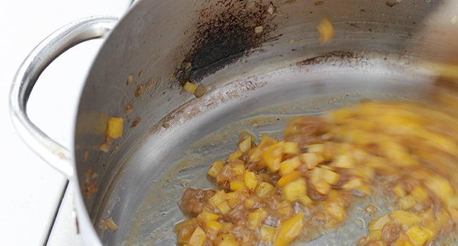 cooking bell peppers with onions