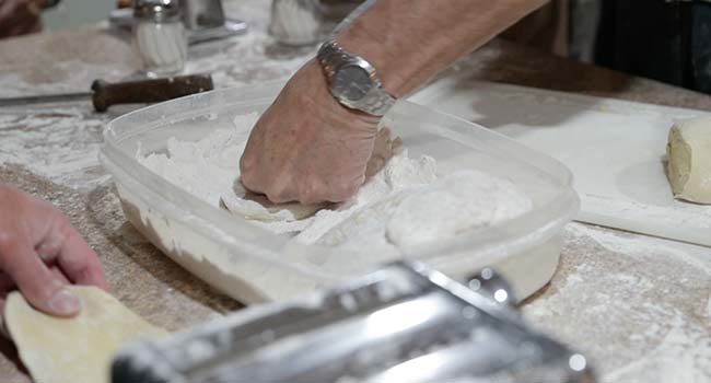 dredging pasta dough in flour