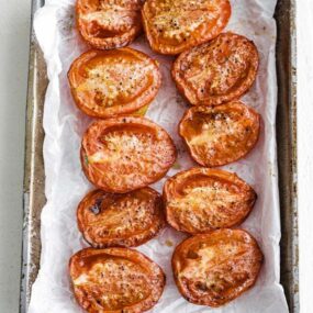 oven roasted tomatoes on a sheet tray