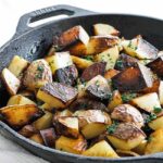 pan-fried potatoes in a skillet