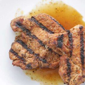 grilled pork chops on a plate