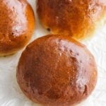 hamburger buns on parchment paper