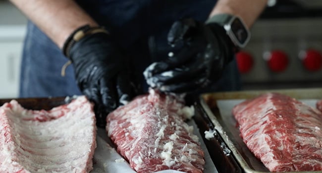 coating the ribs in pork lard