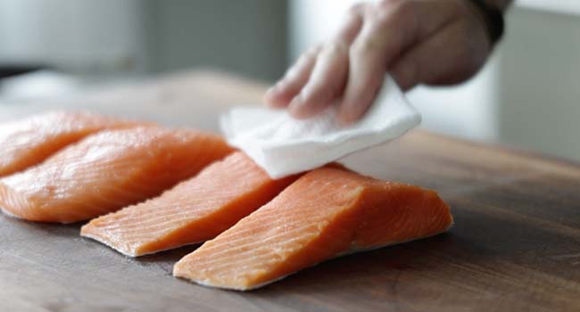 patting salmon dry