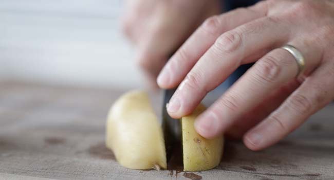 slicing a potato