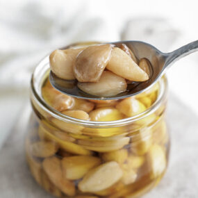 garlic confit on a spoon