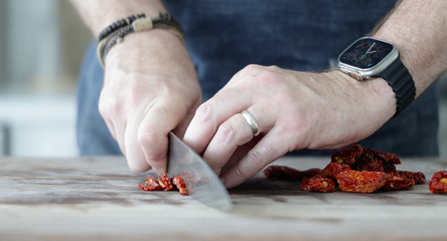 slicing sun dried tomatoes