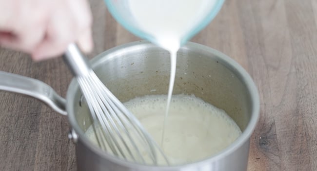 adding cream to a pot