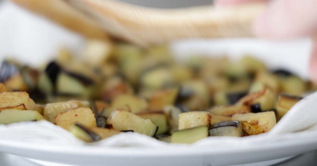 draining fried eggplant