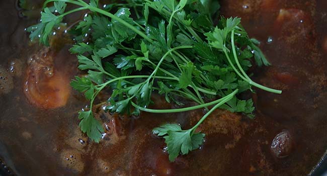 pot of stock with parsley