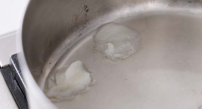 lard melting in a pan