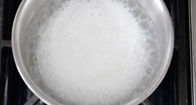 boiling milk in a pot