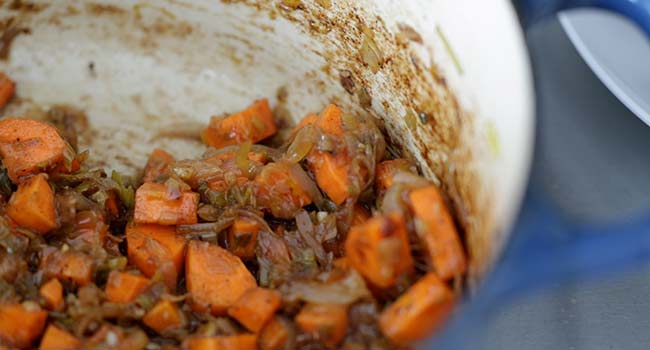 roasted onions and carrots in a pot