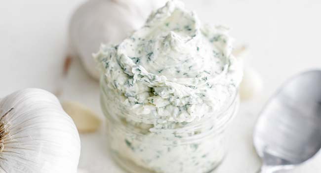 garlic butter with herbs in a jar