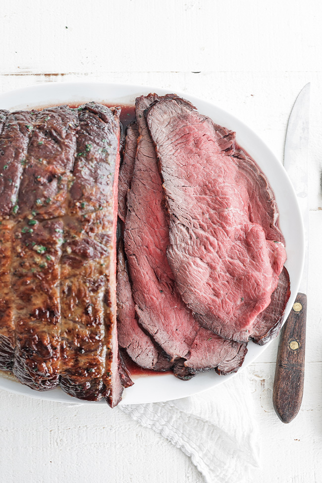 roast beef and slices on a platter