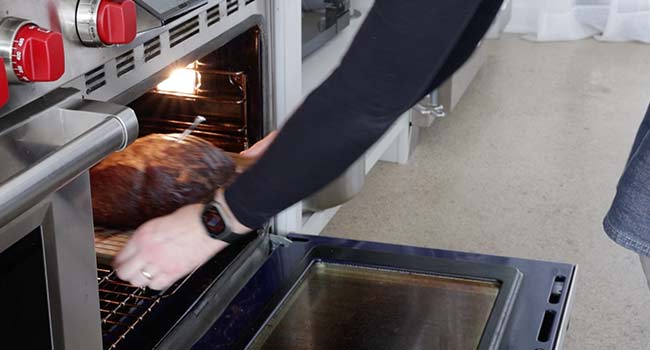 adding pre-cooked beef to an oven