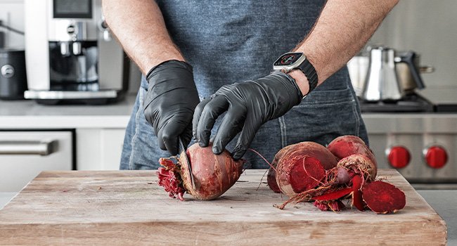 slicing roots off of beets