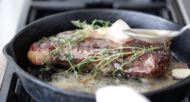 basting a steak