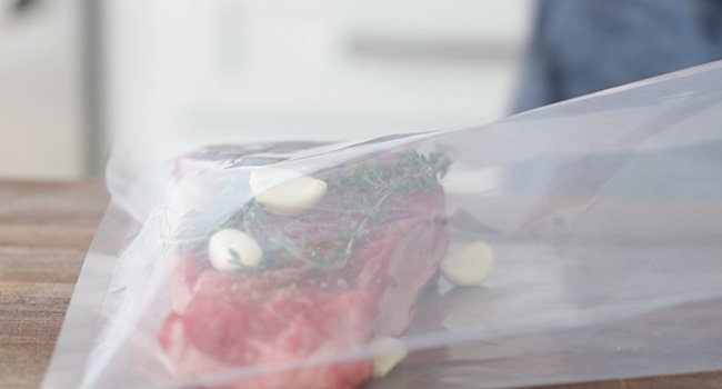 steak with herbs and garlic in a bag