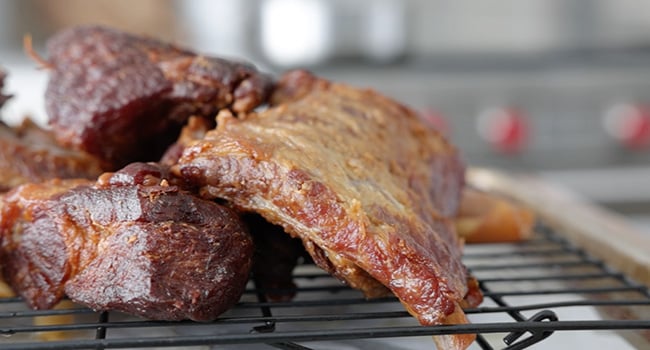 resting carnitas on a rack