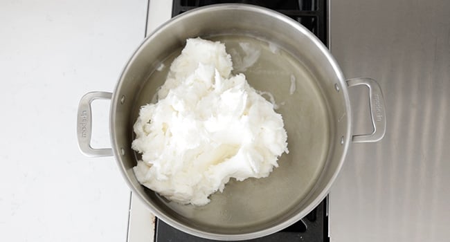 heating lard in a pot