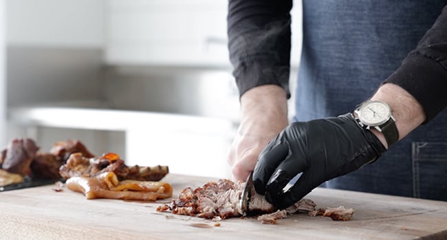 chopping carnitas